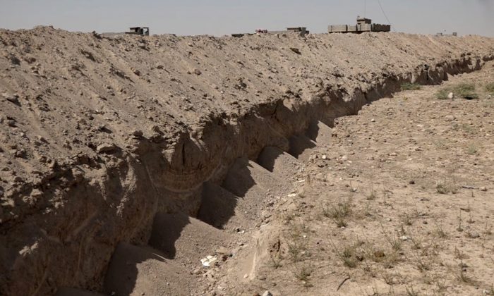 A freshly-dug trench on the outskirts of Fallujah, Iraq, on July 22, 2016. (AP photo via AP video)