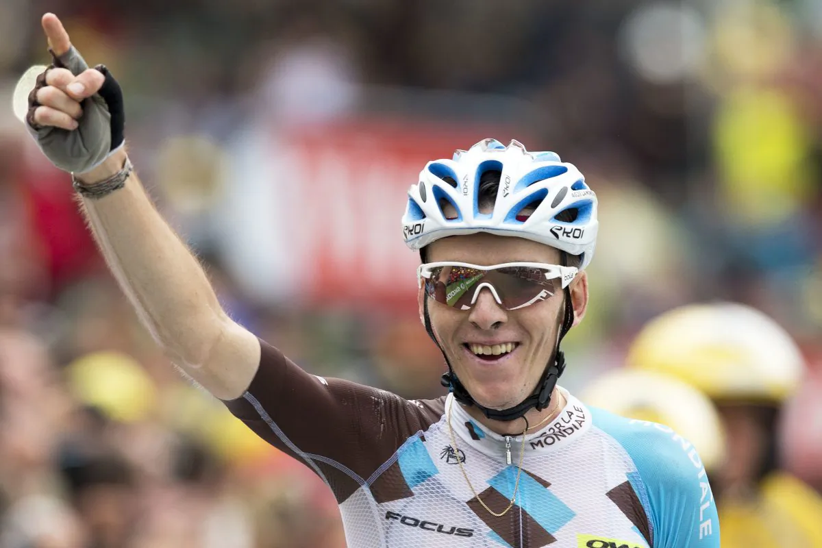 Ag2R's Romain Bardet celebrates as he crosses the finish line to win Stage 19of the Tour de France, 146 kilometers (90.7 miles) from Albertville to Saint-Gervais Mont Blanc, France, Friday, July 22, 2016. (AP Photo/Peter Dejong)