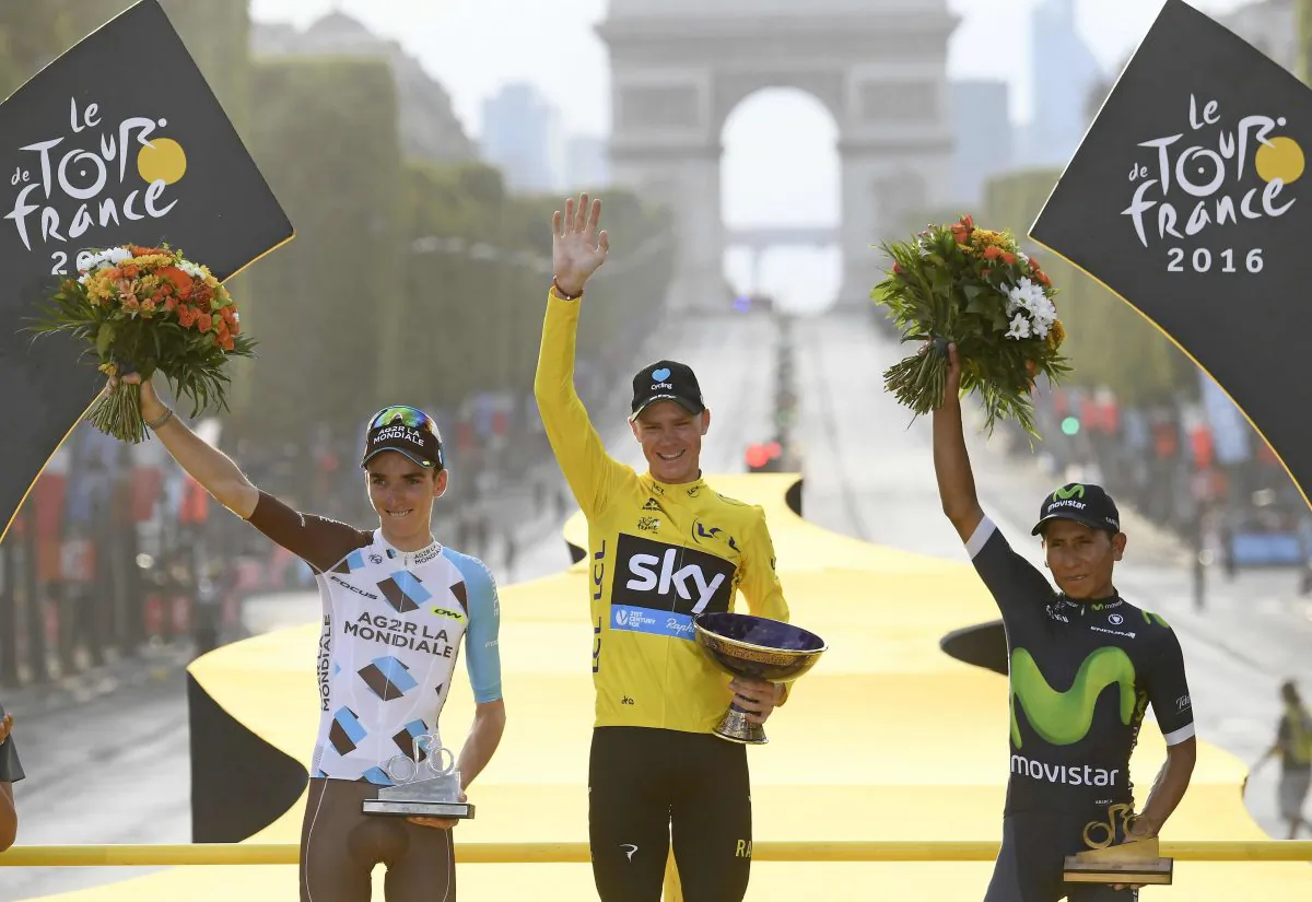Sky's Chris Froome, wearing the overall leader's yellow jersey, second place Romain Bardet of Ag2R, left, and third place Nairo Quintana of Movistar, right, celebrate on the podium after Stage 21 of the 2016 Tour de France in Paris, France, Sunday, July 24, 2016.(Stephane Mantey Pool via AP)