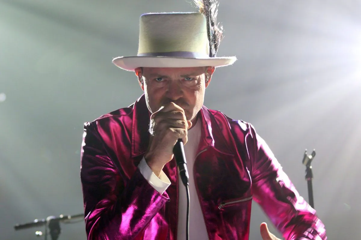 The Tragically Hip's Gord Downie performs during the first stop of the Man Machine Poem Tour at the Save-On-Foods Memorial Centre in Victoria, B.C., on July 22, 2016. (THE CANADIAN PRESS/Chad Hipolito)