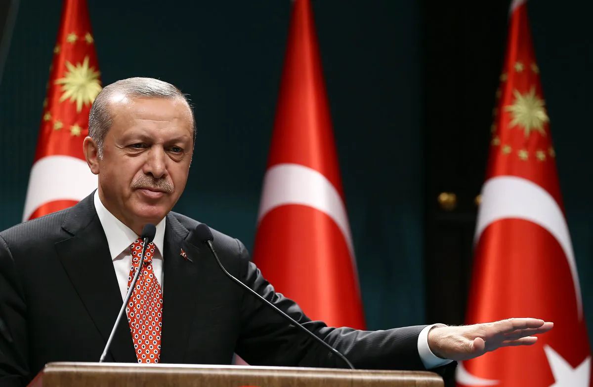 Turkish President Recep Tayyip Erdogan addresses people demonstrating against the failed military coup attempt in Turkey, via video conferencing at the Turkish Presidency in Ankara, Turkey, on July 24, 2016. (Yasin Bulbul/AFP/Getty Images)