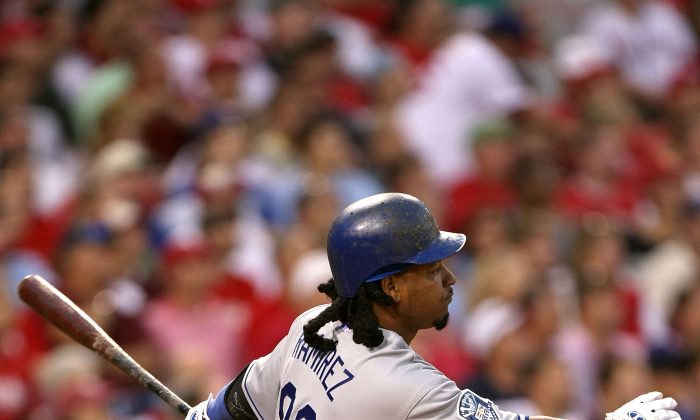 Manny Ramirez went on a tear after being dealt from Boston to Los Angeles, helping the Dodgers to a division title. (Jed Jacobsohn/Getty Images) 