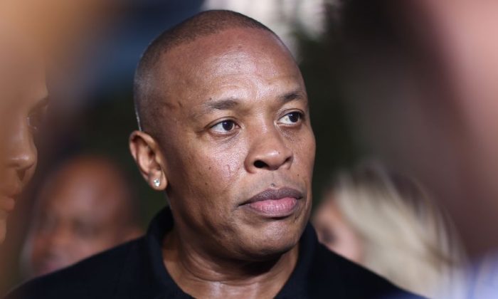 FILE - In this Aug. 10, 2015, file photo, Dr. Dre arrives at the Los Angeles premiere of "Straight Outta Compton." Dr. Dre has been cited after the Los Angeles County Sheriff's Department says a man told them Dre pointed a handgun at him outside of his Malibu, California, home. (Photo by John Salangsang/Invision/AP, File)