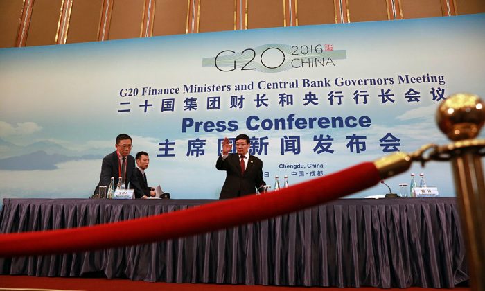 China's Minister of Finance Lou Jiwei arrives for a press conference held at the close of the G20 Finance Ministers and Central Bank Governors meeting in Chengdu on July 24, 2016.  (Ng Han Guan-Pool/Getty Images)