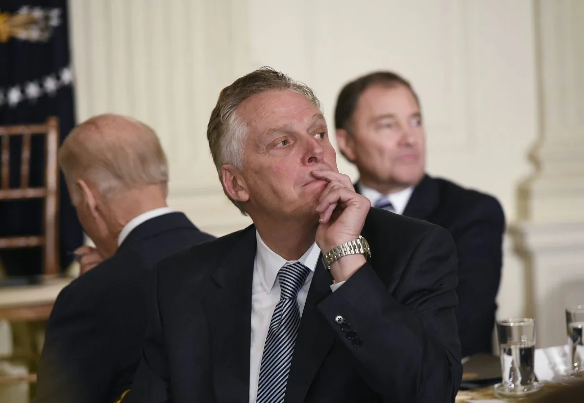 Virginia Gov. Terry McAuliffe listens to a speaker ask a question of then President Barack Obama after Obama addressed the National Governors Association at the White House in Washington on Feb. 22, 2016. (Mandel Ngan/AFP/Getty Images)