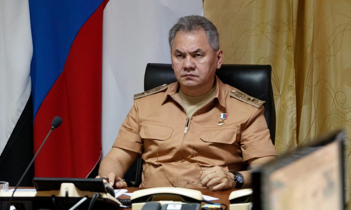 FILE - In this Saturday, June 18, 2016 file photo, Russian Defense Minister Sergei Shoigu visits the Hemeimeem air base in Syria. Shoigu said Thursday, July 28, 2016, Moscow is sending a top general and experts to Geneva at request of U.S. Secretary of State John Kerry to discuss the crisis surrounding the embattled Syrian city of Aleppo. (Vadim Savitsky/Russian Defense Ministry Press Service pool photo via AP, File)