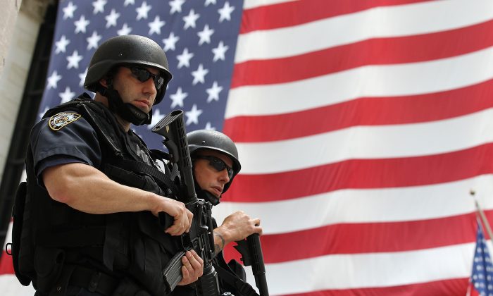New York Police Department tactical police officers stand guard near the New York Stock Exchange in New York City on Sept. 9, 2011. (Justin Sullivan/Getty Images)