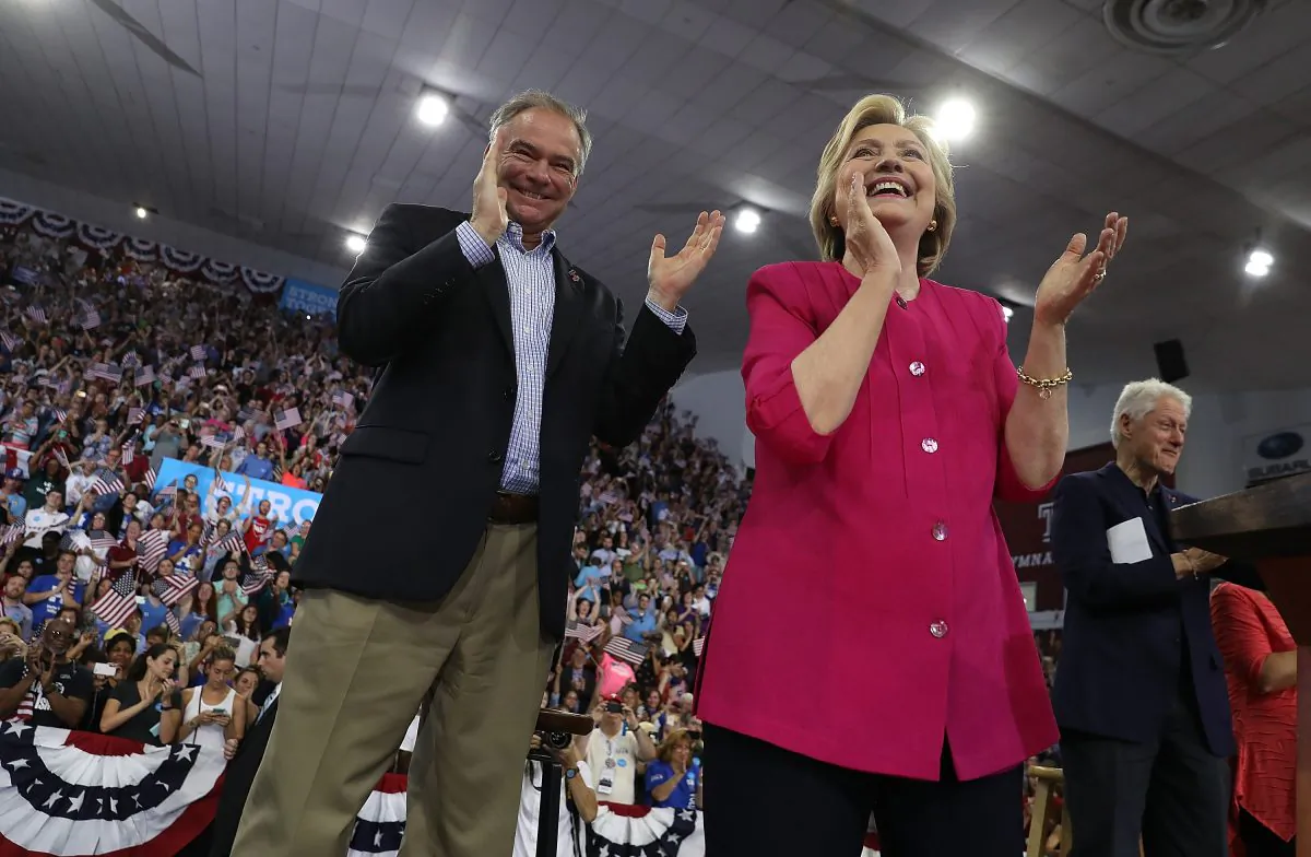 Democratic presidential nominee former Secretary of State Hillary Clinton (R) and democratic vice presidential nominee U.S. Sen. Tim Kaine (D-VA) greet supporters during a campaign rally at Temple University on July 29, 2016 in Philadelphia, Pennsylvania. A day after accepting the democratic presidential and vice presidential nominations at the Democratic National Convention, Hillary Clinton and Tim Kaine are kicking off a three-day bus tour through Pennsylvania and Ohio.  (Photo by Justin Sullivan/Getty Images)
