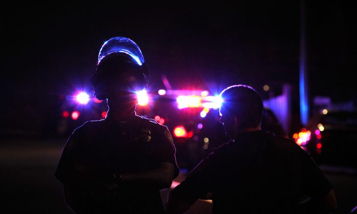 In this file photo, San Diego police and other law enforcement stage near a crime scene in San Diego on July 28, 2016. (John Gastaldo/The San Diego Union-Tribune via AP)