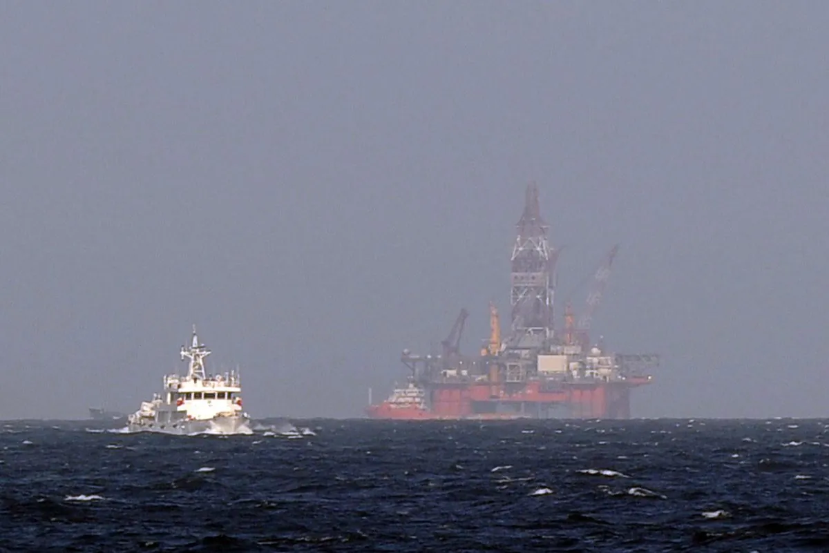 A Vietnamese coast guard ship moves toward a Chinese coast guard vessel near China's oil drilling rig in disputed waters in the South China Sea on May 14, 2014. (Hoang Dinh Nam/AFP/Getty Images)