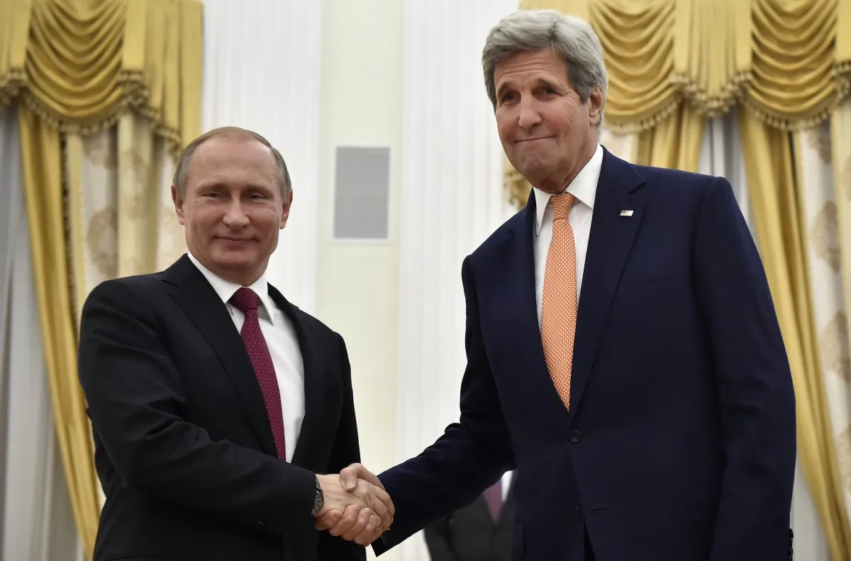 Russian President Vladimir Putin (L) shakes hands with U.S. Secretary of State John Kerry during a meeting at the Kremlin in Moscow, on March 24, 2016. (Alexander Nemenov/AFP/Getty Images)
