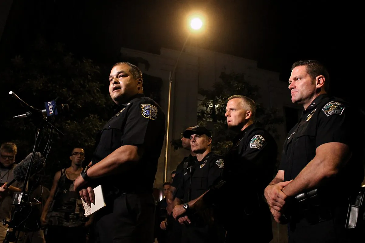 Austin Police Department officers address the media early Sunday morning, July 31, 2016,  (Joshua Guerra/The Daily Texan via AP) MANDATORY CREDIT