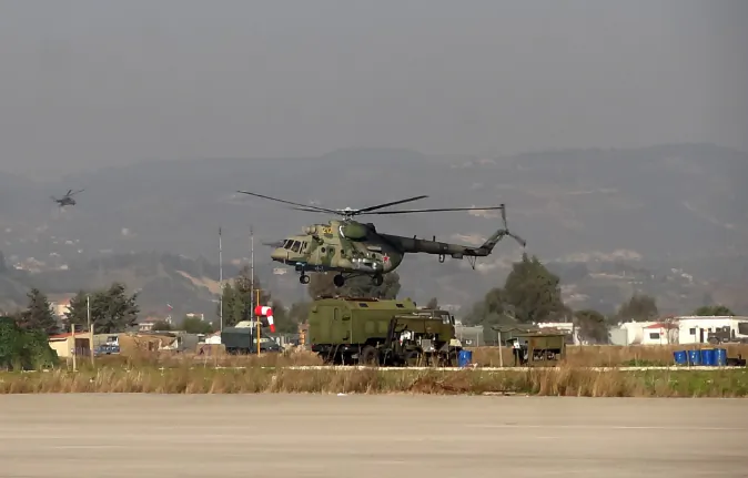 A military helicopter is seen at the Russian Hmeimim military base in Latakia province, in the northwest of Syria, on February 16, 2016. (STRINGER/AFP/Getty Images)
