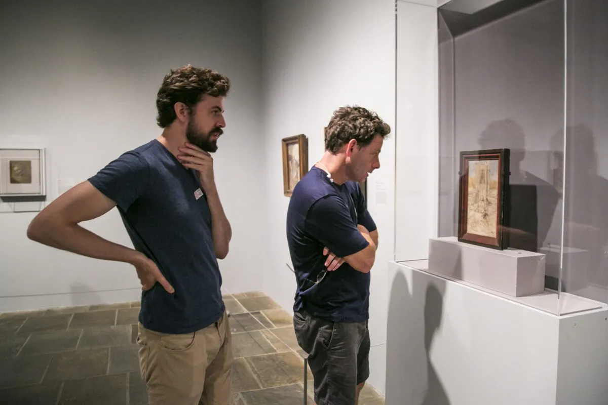 Artists Edmond Rochat (L) and Jacob Collins look at "Saint Barbara" by Jan van Eyck at The Met Breuer in New York on July 15, 2016. (Milene Fernandez/Epoch Times)