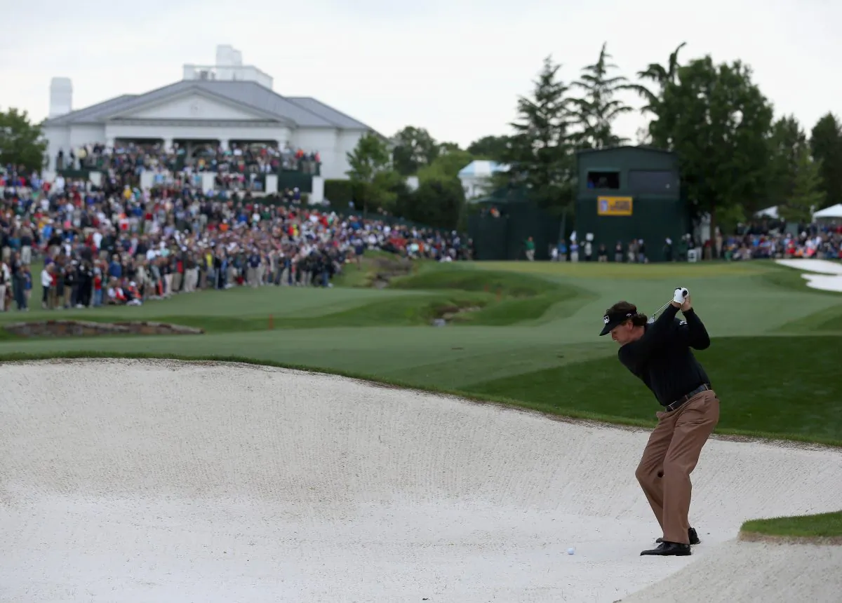 Phil Mickelson hits a shot from the fairway bunker on the 18th hole during the third round of the Wells Fargo Championship at Quail Hollow Club on May 4, 2013. (Streeter Lecka/Getty Images)