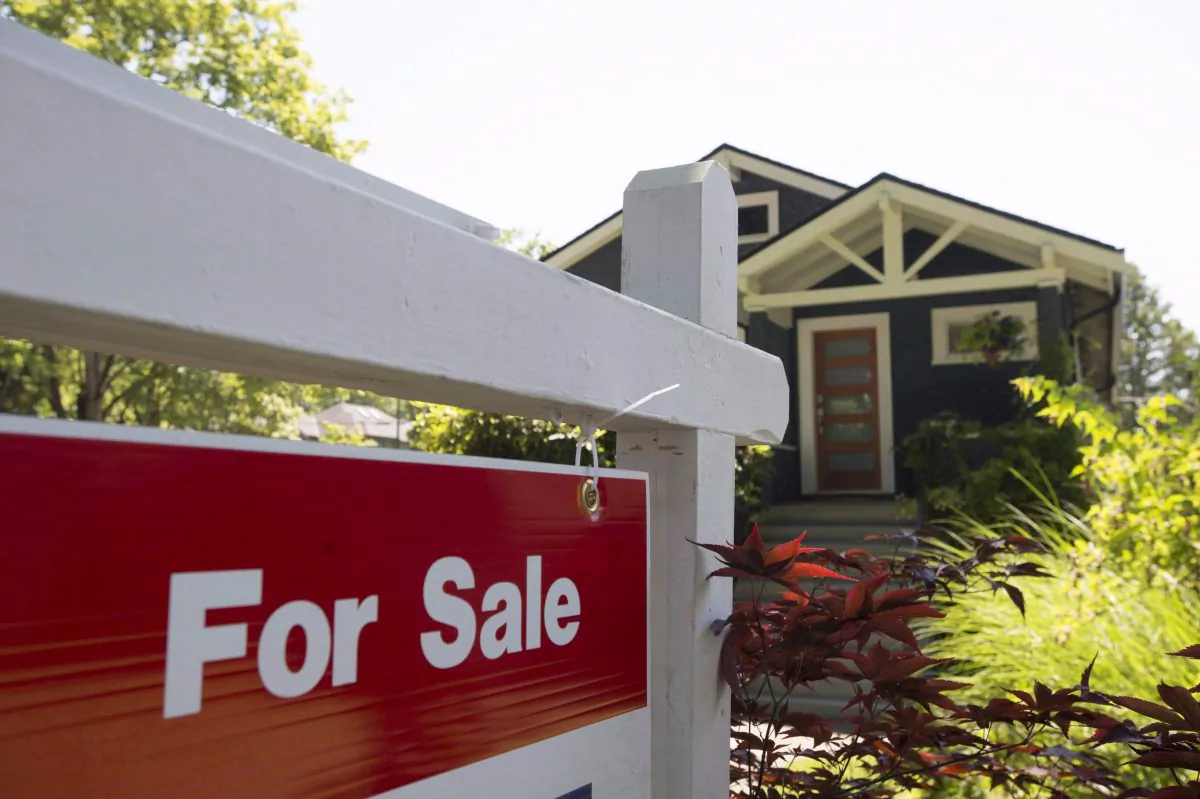 A file photo of a sold sign outside a home in Vancouver. (The Canadian Press/Jonathan Hayward)