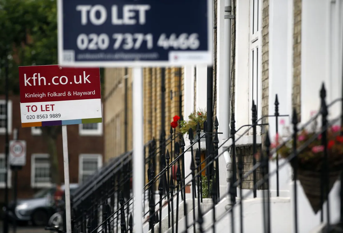 To Let signs stand next to a properties in west London on Aug. 2, 2016. (Alastair Grant/AP Photo)