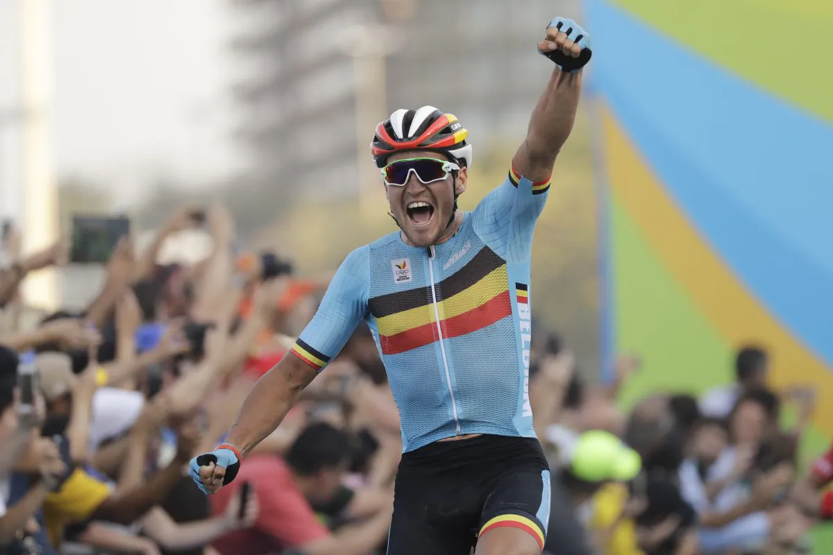 Greg Van Avermaet of Belgium celebrates after crossing the finish line to win the men's cycling road race final at the 2016 Summer Olympics in Rio de Janeiro, Brazil, Saturday, Aug. 6, 2016. (AP Photo/Patrick Semansky)