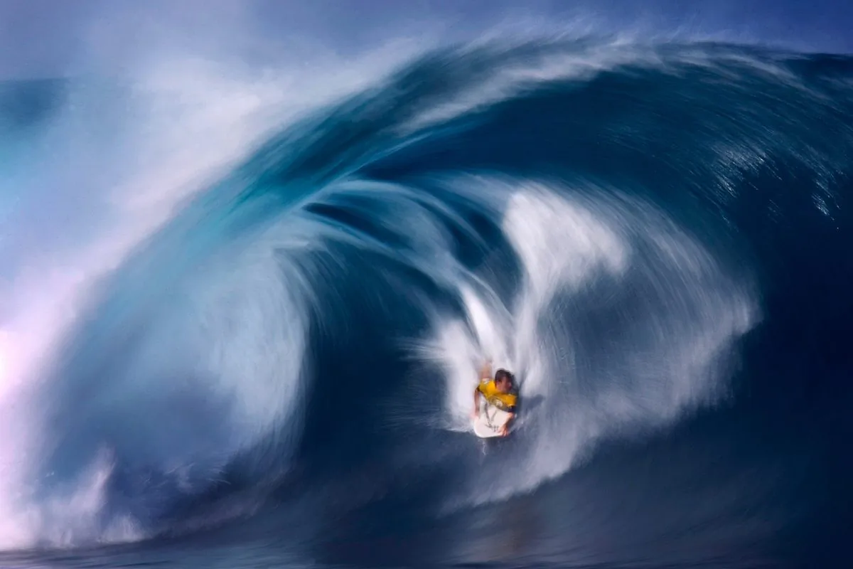 Ryan Hardy of Australia bodyboards a large wave while competing at Rockstar Games Pipeline Pro Bodyboarding contest at the Pipeline on the North Shore of Oahu, Hawaii, on Jan. 12, 2007. (Donald Miralle/Getty Images)