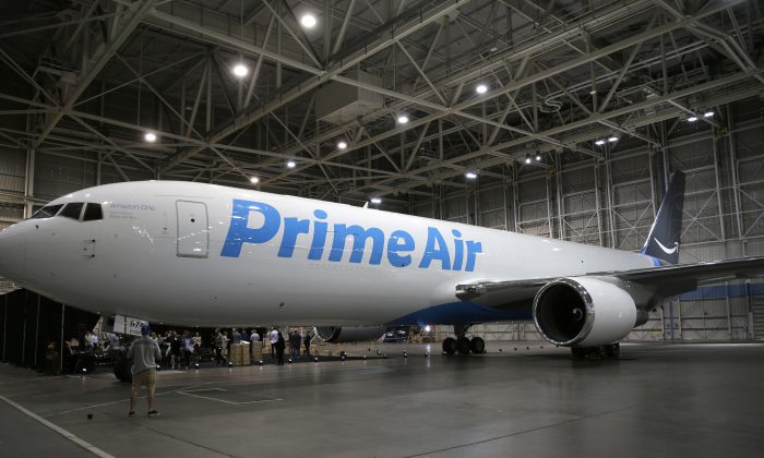A Boeing 767, an Amazon.com "Prime Air" cargo plane is parked on display in a Boeing hangar in Seattle, on Aug. 4. (Ted S. Warren/AP Photo)