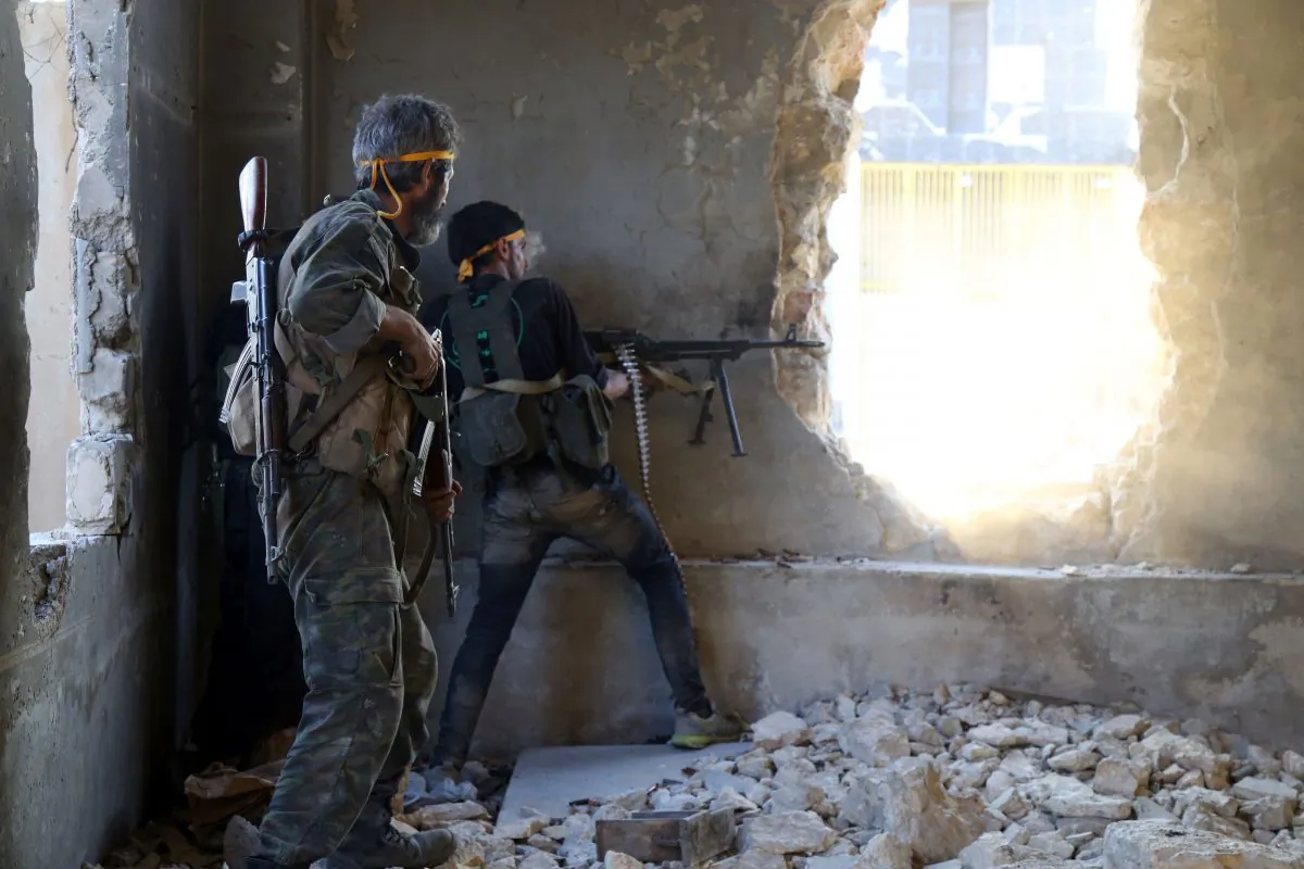 Rebel fighters fire towards positions of regime forces in Ramussa on the southwestern edges of Syria's northern city of Aleppo on Aug. 6, 2016. (Fadi al-Halabi/AFP/Getty Images)