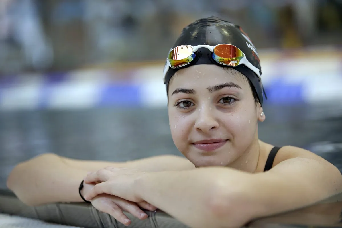 Yusra Mardini from Syria during a training session in Berlin, Germany, on Nov. 9, 2015. (AP Photo/Michael Sohn)