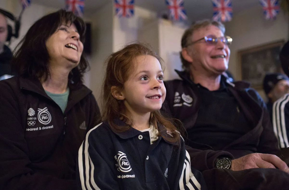  Winter Olympian, Shelley Rudman's Mum Josie Rudman, daughter Ella Bromley, and Dad Jack Rudman show their Support whilst watching her compete at Sochi, on TV on February 14, 2014 at her local Pub In Pewsey, United Kingdom.  (Photo by David Levenson/Getty Images for P&G's TYM Campaign)