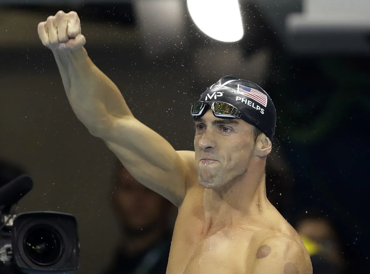 United States' Michael Phelps celebrates after winning the gold medal during the swimming competitions at the 2016 Summer Olympics, Tuesday, Aug. 9, 2016, in Rio de Janeiro, Brazil. (AP Photo/Michael Sohn)