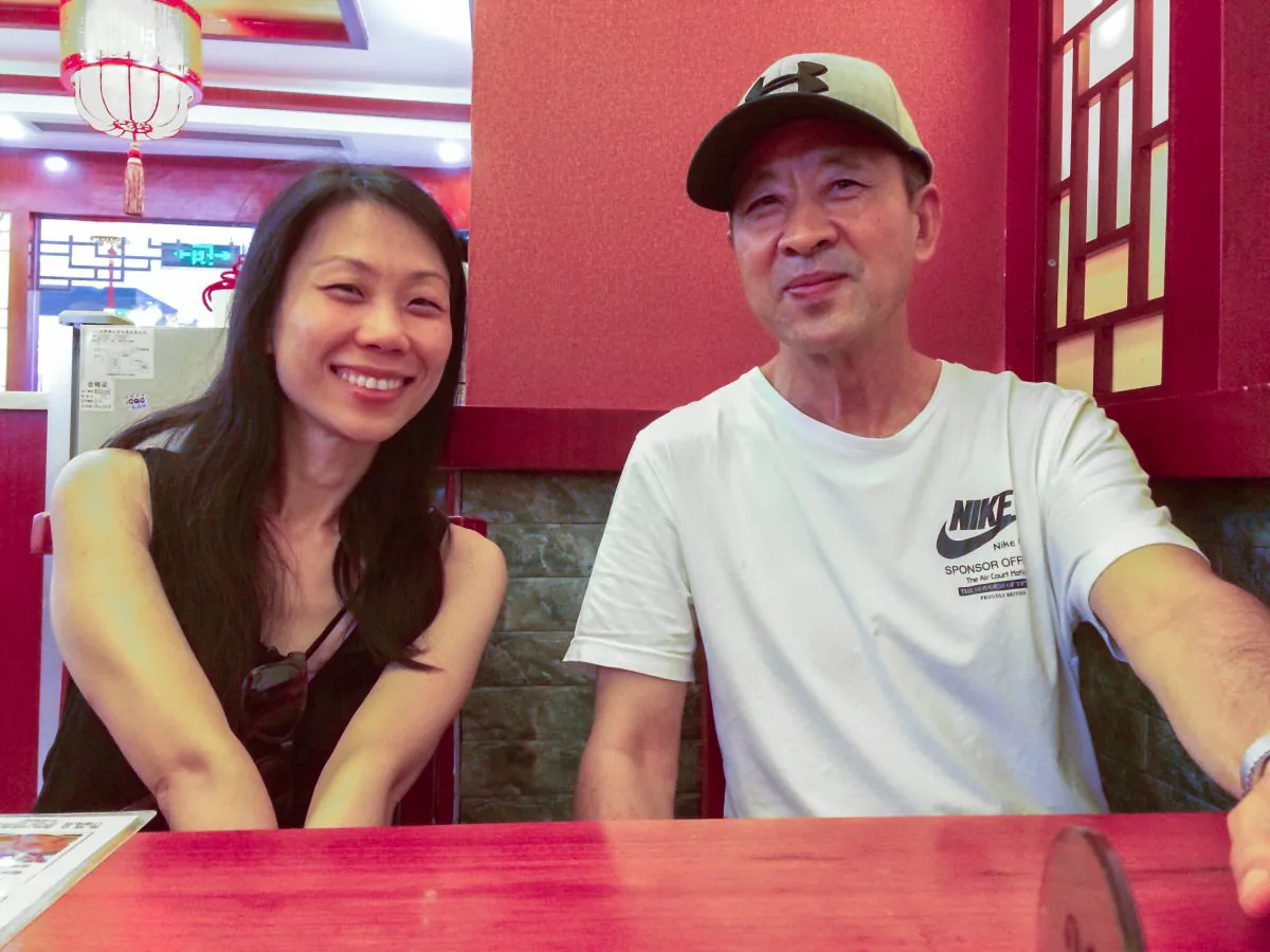 Wang Xiaodan with her father Wang Zhiwen in China. (courtesy of Wang Xiaodan/Epoch Times)