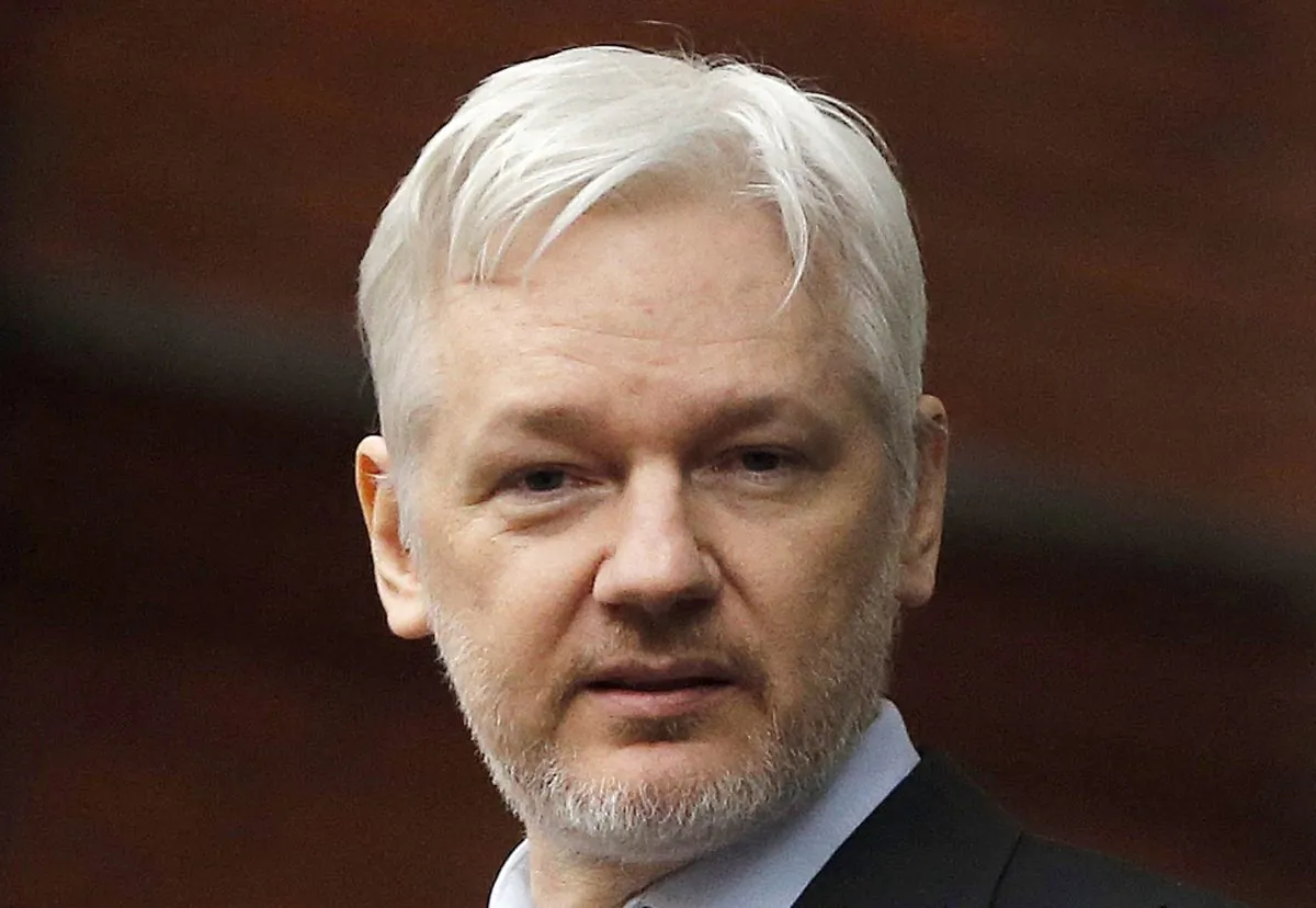 In this Feb. 5, 2016, file photo, WikiLeaks founder Julian Assange stands on the balcony of the Ecuadorean Embassy in London. (AP Photo/Frank Augstein, File)