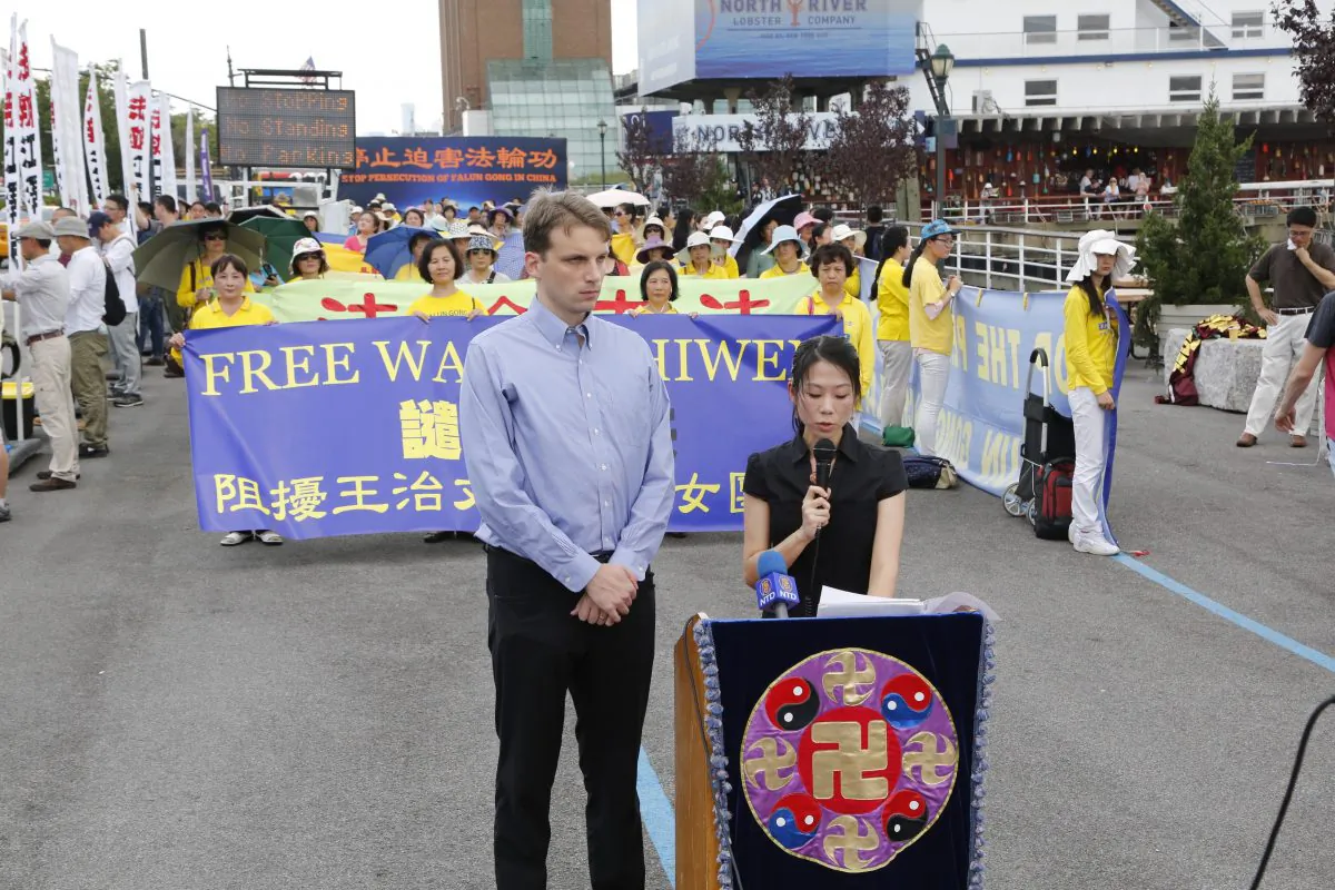 Danielle Wang speaks for her father, Wang Zhiwen, at a demonstration in Manhattan before the Chinese Consulate. (Leo Timm/Epoch Times)