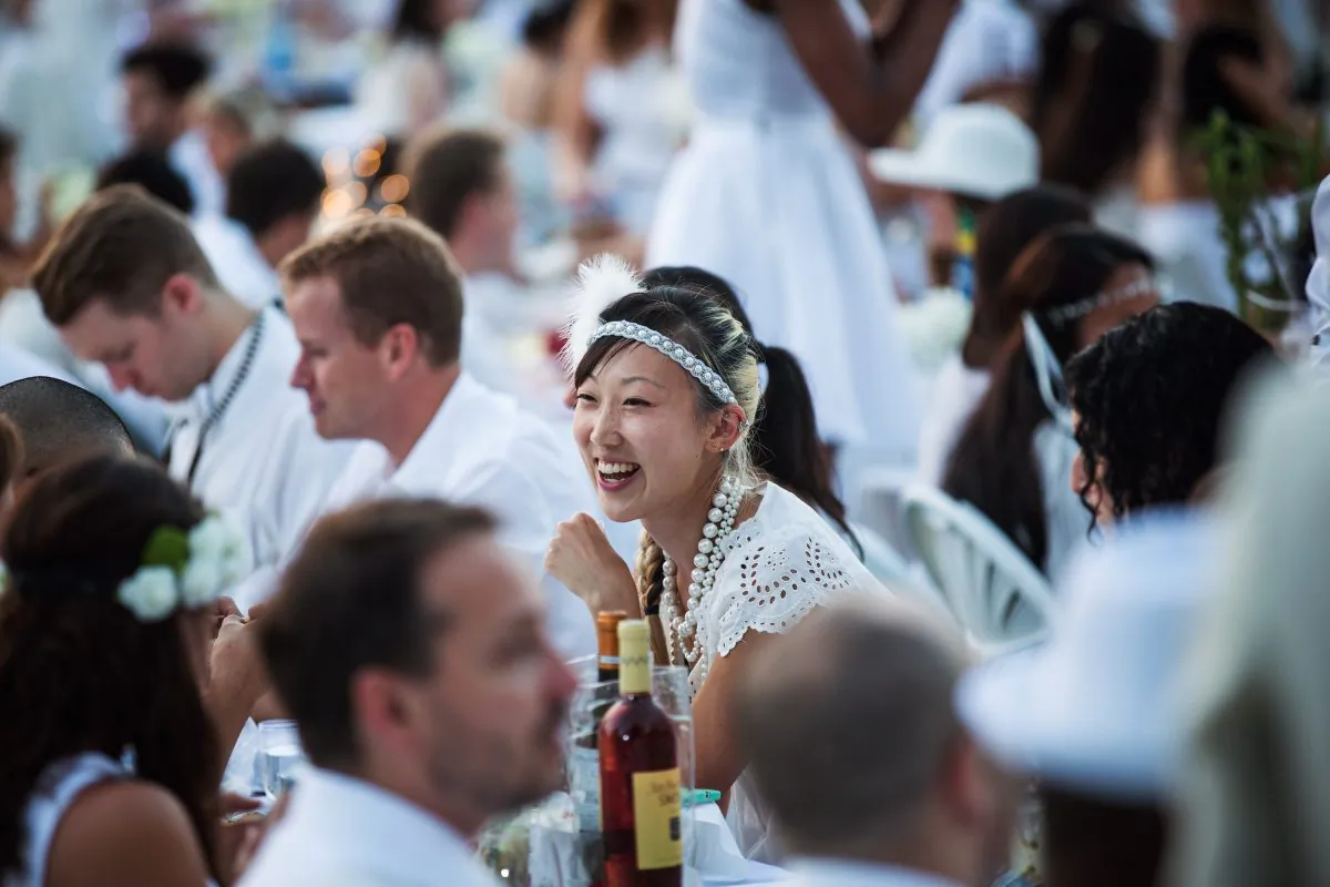 NEW YORK, NY - AUGUST 25:  People attend Diner en Blanc (French for Dinner in White), a pop-up dinner held once a year in New York on August 25, 2014 in the Battery Park City neighborhood of New York City.  (Andrew Burton/Getty Images)