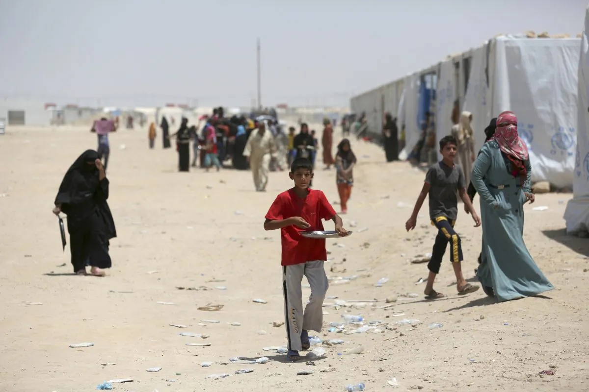 Internally displaced civilians, who fled their homes during fighting between Iraqi security forces and Islamic State to a camp at Amariyah, in Fallujah, Iraq, on June 25, 2016. (AP Photo/ Khalid Mohammed)