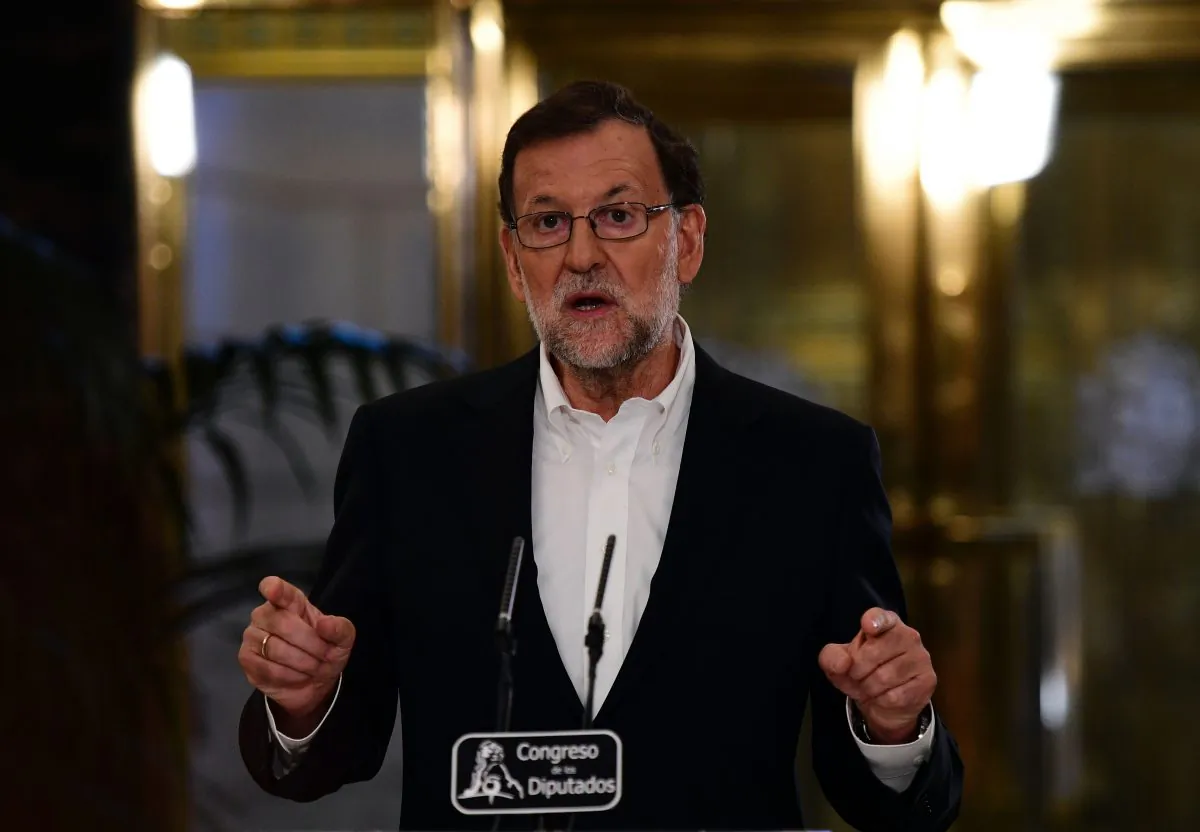 Spanish interim Prime Minister Mariano Rajoy speaks after a meeting with Spanish Leader of center-right party Ciudadanos at the Spanish parliament in Madrid on Aug. 10, 2016 on forming a government in a bid to unblock seven months of political paralysis after a second round of inconclusive elections. (Gerard Julien/AFP/Getty Images)