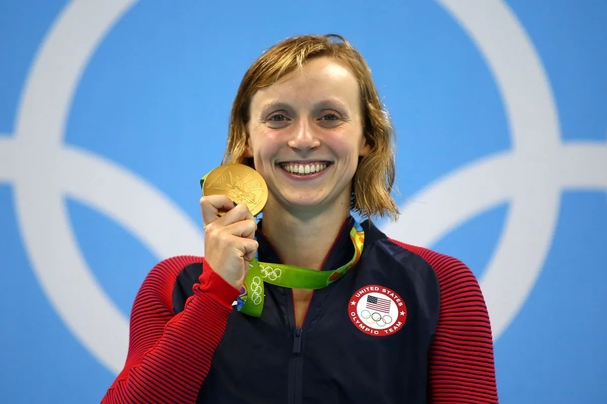 Katie Ledecky of United States celebrates on the podium after winning gold in the Women's 800 Meter Freestyle Final on Day 7 of the Rio 2016 Olympic Games at the Olympic Aquatics Stadium in Rio de Janeiro, Brazil, on Aug. 12, 2016. (Clive Rose/Getty Images)