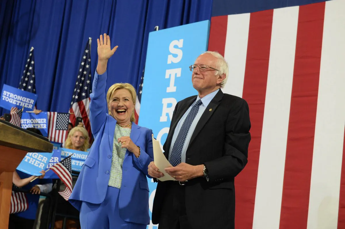 Hillary Clinton and Bernie Sanders at Portsmouth High School July 12, 2016 in Portsmouth, New Hampshire. (Photo by Darren McCollester/Getty Images)