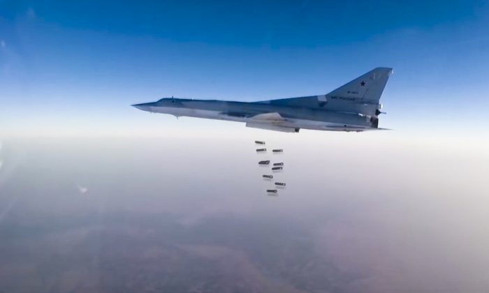 In this frame grab from video provided by the Russian Defence Ministry Press Service, Russian long range bomber Tu-22M3 flies during a strike above an undisclosed location in Syria on Aug. 14, 2015. (Russian Defence Ministry press service photo via AP)