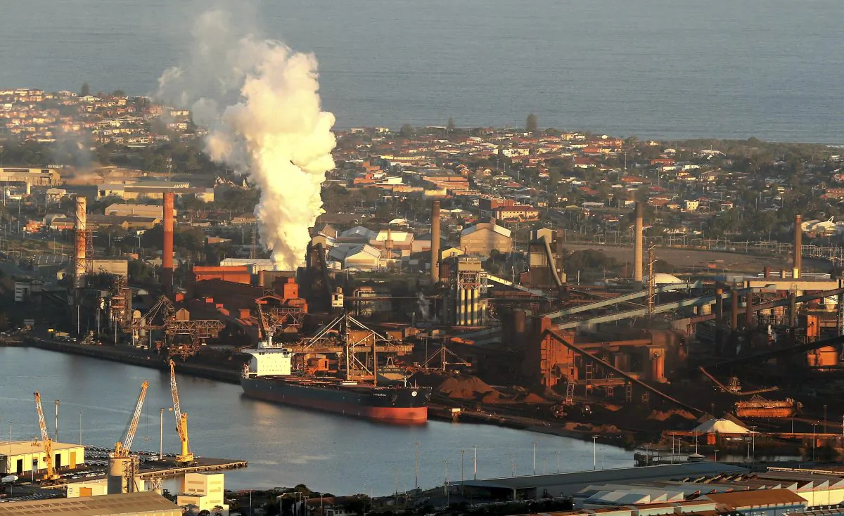 Smoke billows out of a chimney stack of BHP steelwork factories at Port Kembla, south of Sydney, Australia. (AP Photo/Rob Griffith, File)