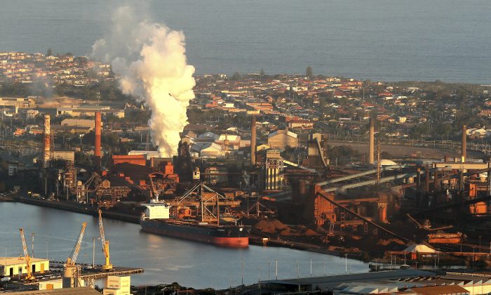 Smoke billows out of a chimney stack of BHP steelwork factories at Port Kembla, south of Sydney, Australia. (AP Photo/Rob Griffith, File)
