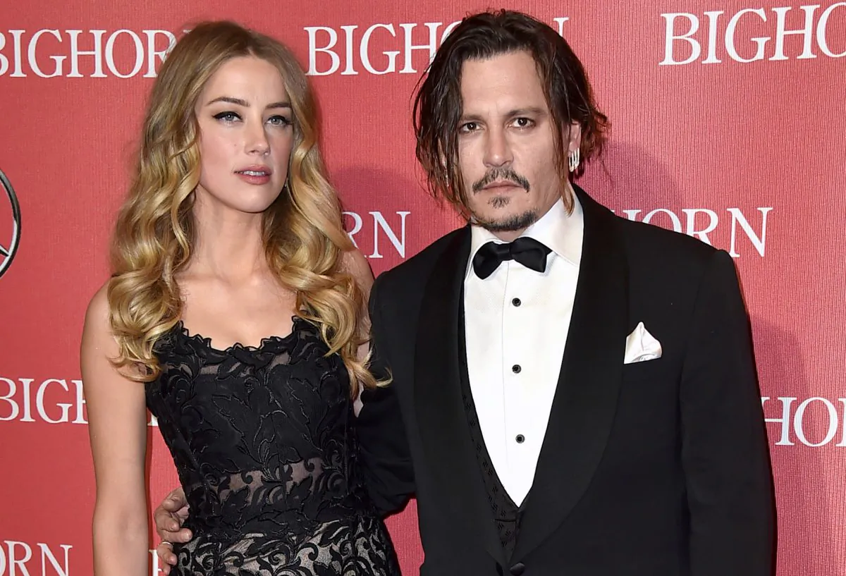 Amber Heard, left, and Johnny Depp arrive at the 27th annual Palm Springs International Film Festival Awards Gala in Palm Springs, Calif. on Jan. 2, 2016. (Photo by Jordan Strauss/Invision/AP)