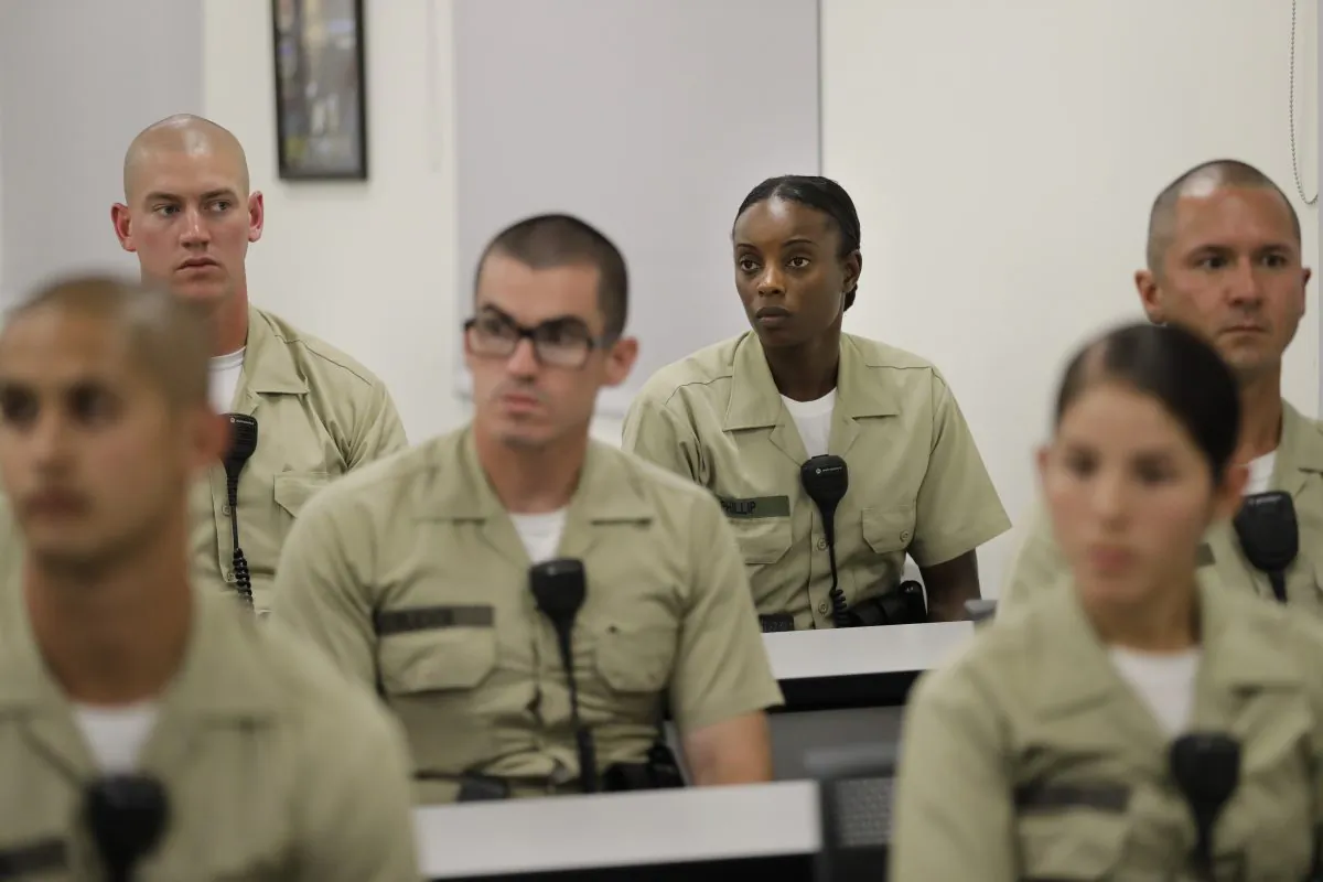 Los Angeles County sheriff's deputy recruit Renata Phillip, third from right, listens to a lecture in a classroom at the Biscailuz Regional Training Center in Monterey Park, Calif. on July 19. (AP Photo/Jae C. Hong)