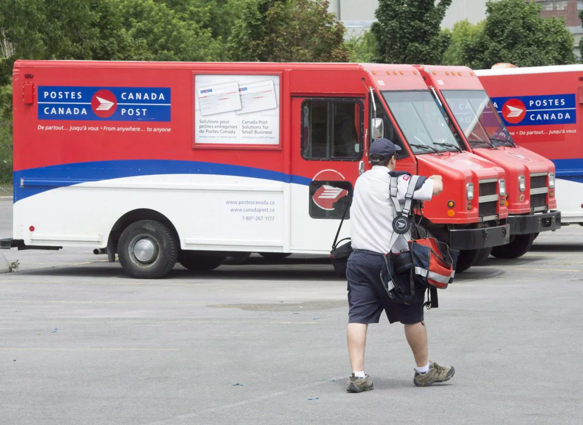 Canada Post trucks at a sorting centre in Montreal in an undated photo. (THE CANADIAN PRESS/Ryan Remiorz)