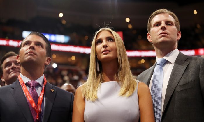 Donald Trump Jr. (L), Ivanka Trump (C), and Eric Trump (R), take part in the roll call on the second day of the Republican National Convention at the Quicken Loans Arena in Cleveland, Ohio, on July 19, 2016. (Joe Raedle/Getty Images)