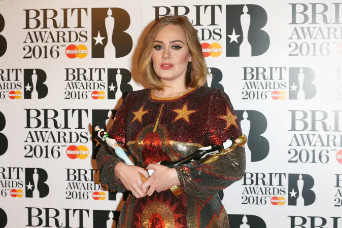 Adele poses in the winners room at the BRIT Awards 2016 with her 4 Brit awards at The O2 Arena on February 24, 2016 in London, England. (Luca Teuchmann/Getty Images)