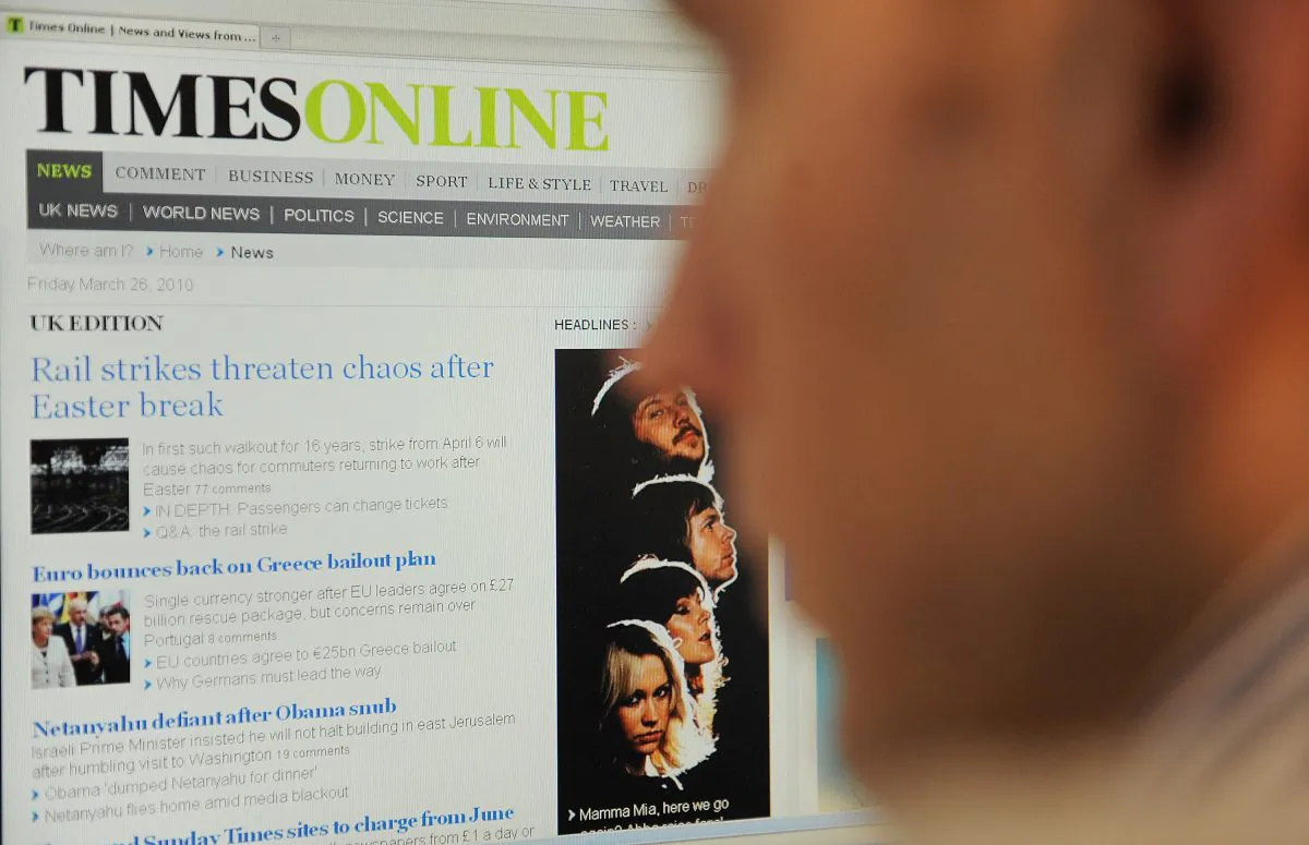 British newspapers The Times and The Sunday Times have charged readers to access the titles online since March 2010. Paywalls have failed to help rescue newspapers from the crisis of sinking print circulation, according to a new study. (BEN STANSALL/AFP/Getty Images)