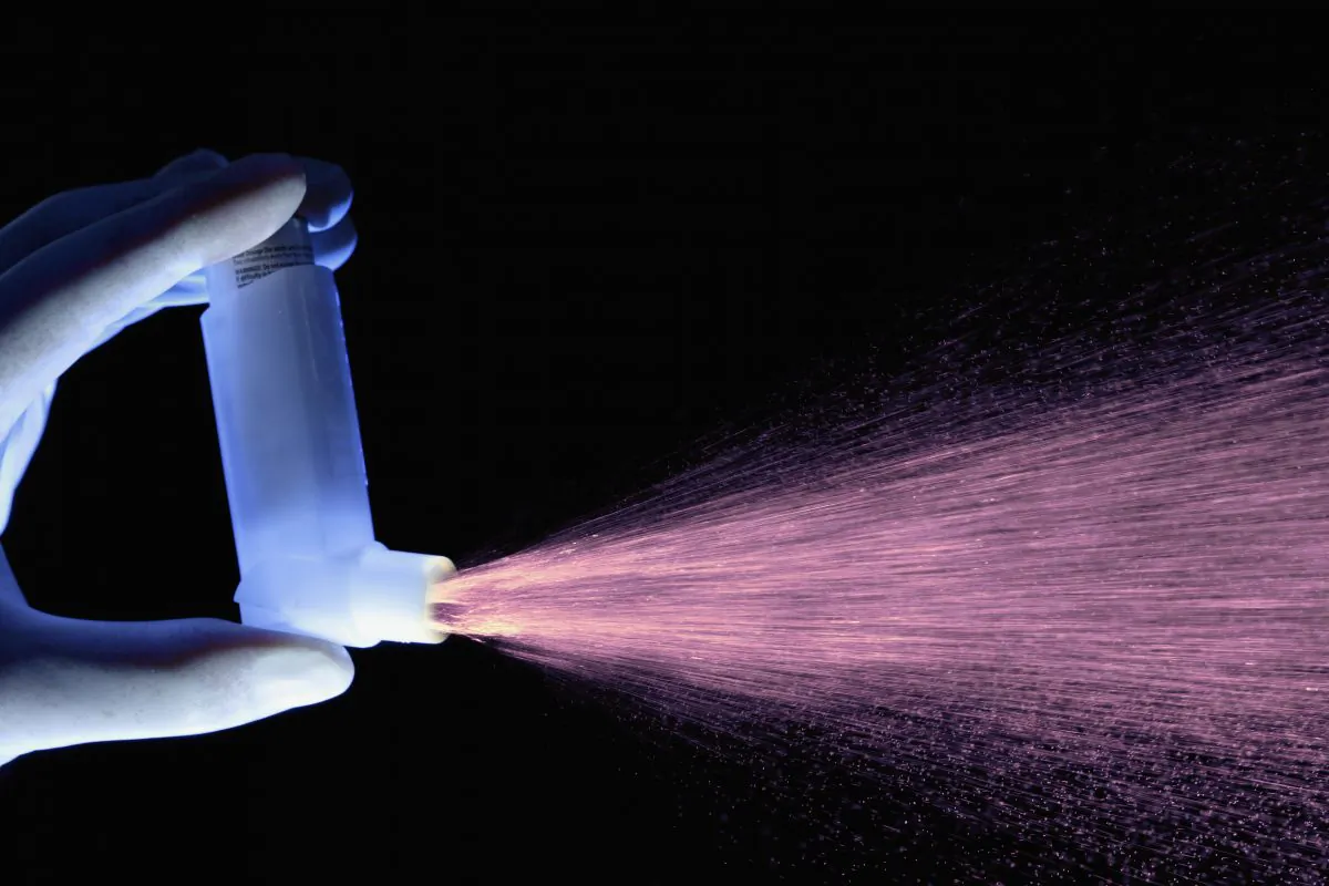 File photo of an asthma inhaler dispensing a dose of drug. A woman  was jailed in Croydon, UK, for subjecting her children to unnecessary medical procedures, including medication to treat severe asthma, so that she could claim hundreds of thousands of pounds in state benefits. (Getty Images)