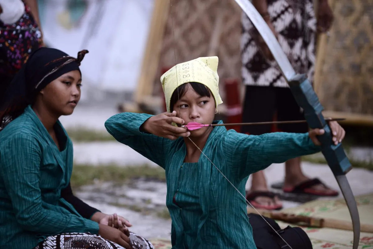 A young archer in traditional outfit practises the centuries-old
Indonesian sport of ‘Jemparingan’. After decades of decline, a revival is under way. (GOH CHAI HIN/AFP/Getty Images)