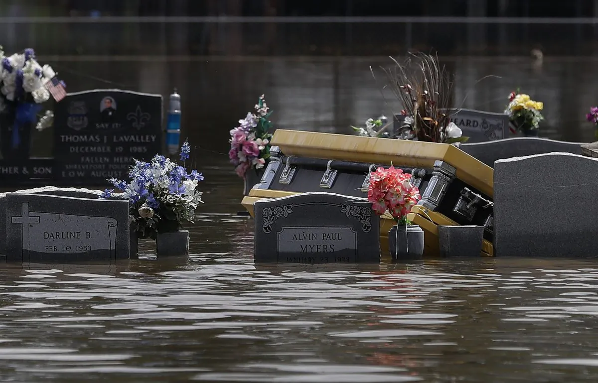 A casket is seen in a flooded cemetery on August 17, 2016 in Sorrento, Louisiana. Tremendous downpours has resulted in disastrous flooding, responsible for at least seven deaths and thousands of homes being damaged. (Photo by Joe Raedle/Getty Images)