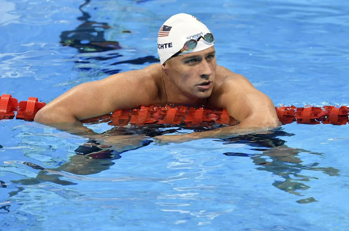 USA' Ryan Lochte checks his time after a men' 4x200-meter freestyle relay heat during the swimming competitions at the 2016 Summer Olympics in Rio de Janeiro, Brazil, on Aug. 9, 2016. (AP Photo/Martin Meissner)