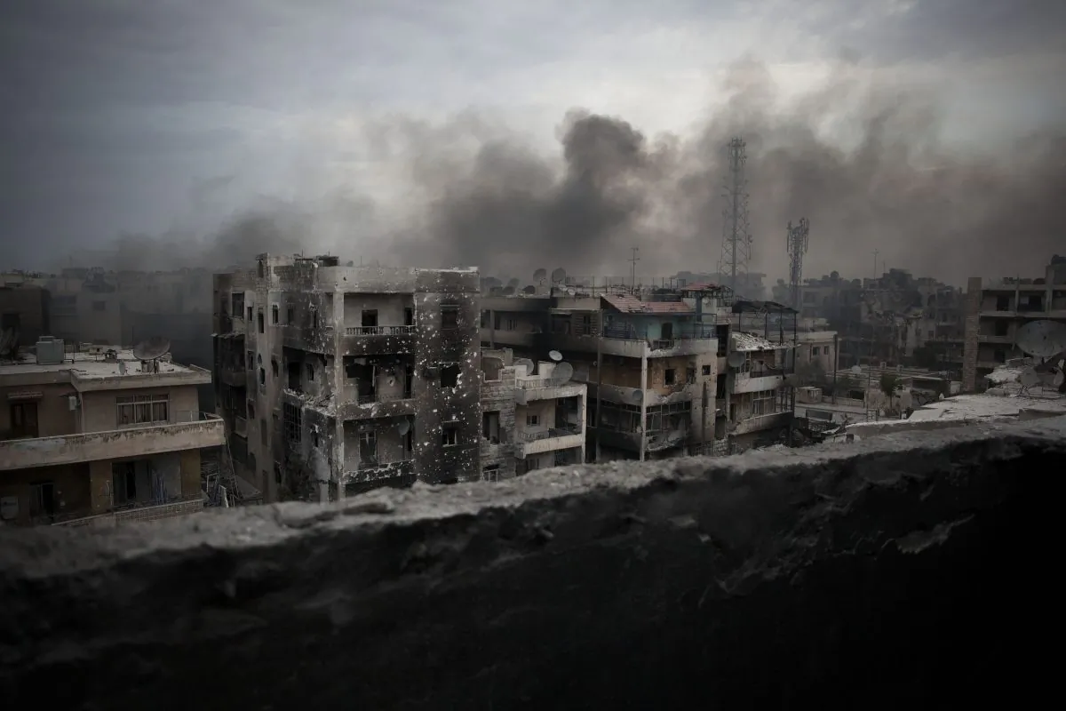 Smoke rises over Saif al-Dawla District in Aleppo, Syria, Oct. 2, 2012. (AP Photo/ Manu Brabo)